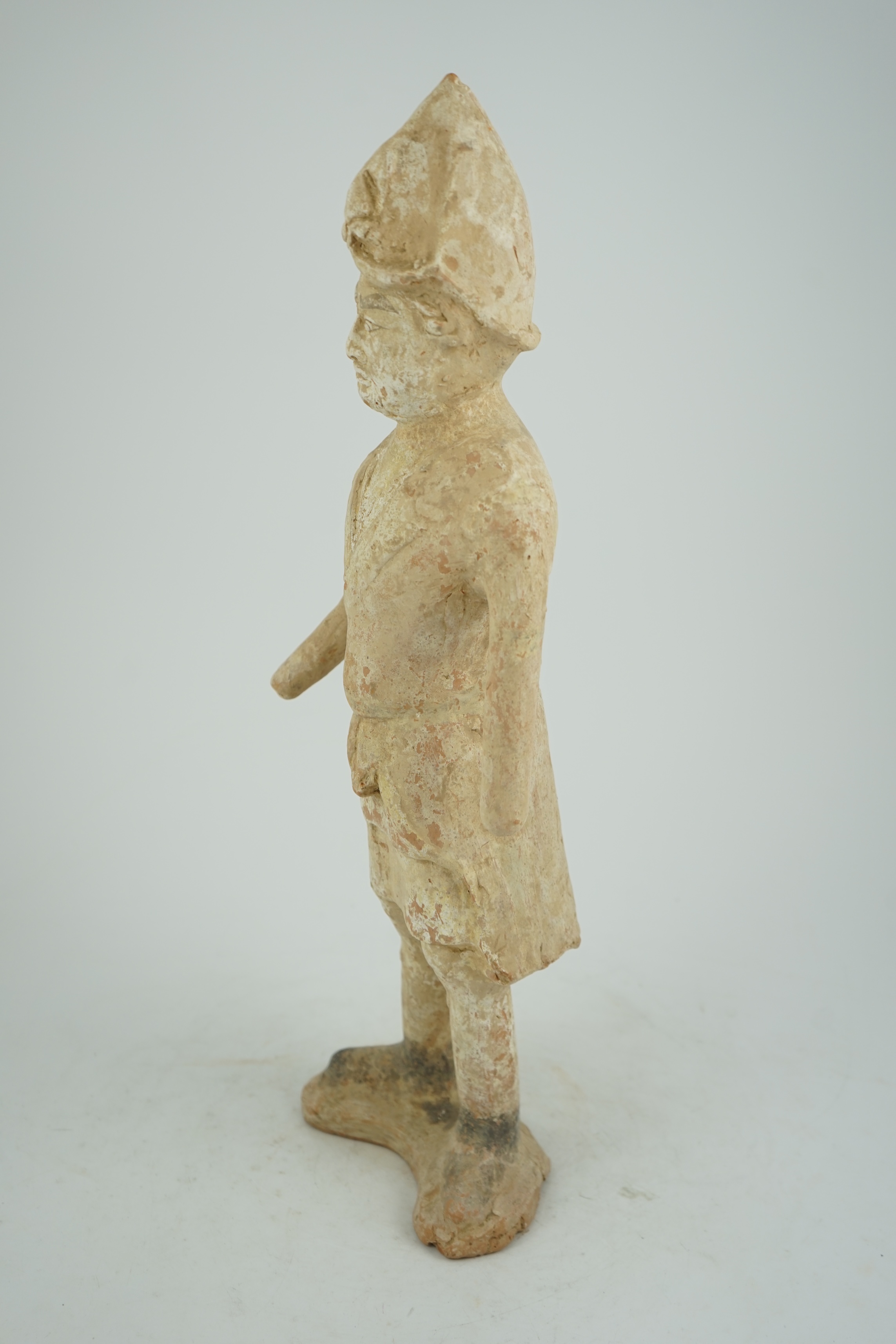 A tall Chinese painted pottery foreigner figure, Tang Dynasty (AD 618-906)